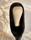 A straight black wig with a natural beige lace front